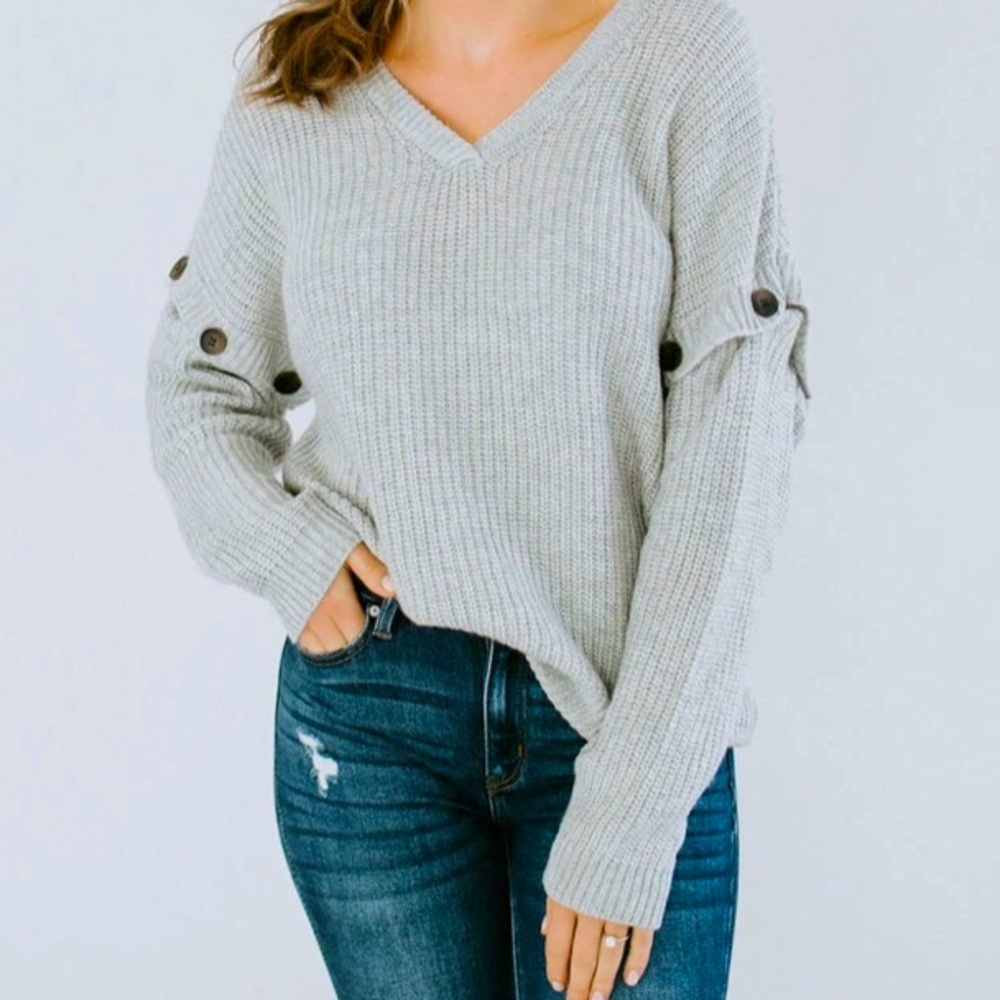 Brand new with tags boutique sweater. Size small.